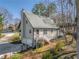 View of the home featuring two garage doors, a fenced yard, and a back deck with stairs leading to the yard at 504 Hanover Ct, Woodstock, GA 30188