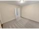 Cozy bedroom featuring neutral carpet and ample natural light at 272 Laurel Canyon Pkwy, Canton, GA 30114