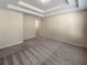 Spacious Primary bedroom featuring tray ceilings and neutral carpet at 272 Laurel Canyon Pkwy, Canton, GA 30114