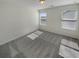 Cozy bedroom with plush carpet, two windows and neutral walls, perfect for relaxation at 272 Laurel Canyon Pkwy, Canton, GA 30114
