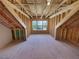 Spacious bonus room with unfinished walls and large window for plenty of natural light at 272 Laurel Canyon Pkwy, Canton, GA 30114