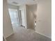 Hallway features neutral carpet, natural lighting, and access to rooms at 272 Laurel Canyon Pkwy, Canton, GA 30114