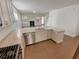 Well-lit kitchen featuring granite countertops, stainless steel appliances, and an open layout to the living area at 272 Laurel Canyon Pkwy, Canton, GA 30114