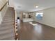Bright, open-concept living space featuring hardwood floors, stainless steel appliances and a staircase at 272 Laurel Canyon Pkwy, Canton, GA 30114