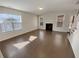 Bright living room with hardwood floors, a fireplace, and plenty of natural light at 272 Laurel Canyon Pkwy, Canton, GA 30114