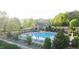 Resort style pool with sundeck and clubhouse with stone fireplace and lots of trees at 272 Laurel Canyon Pkwy, Canton, GA 30114