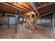 Basement with concrete floor, wooden beams, and stairs at 4693 Sugar Hill Se Rd, Acworth, GA 30102