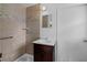 Tiled bathroom with updated fixtures, large mirror, and sink at 4693 Sugar Hill Se Rd, Acworth, GA 30102