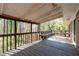 Spacious outdoor deck with built-in benches, offering a serene space with views of the surrounding greenery at 4693 Sugar Hill Se Rd, Acworth, GA 30102