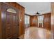 Inviting entryway with a decorative front door and wood-paneled walls at 4693 Sugar Hill Se Rd, Acworth, GA 30102