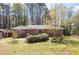 Charming brick home with a well-maintained front yard and mature landscaping at 4693 Sugar Hill Se Rd, Acworth, GA 30102