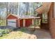 Garage and back door to a brick home at 4693 Sugar Hill Se Rd, Acworth, GA 30102