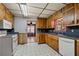 Kitchen area with wooden cabinets and a stainless steel sink at 4693 Sugar Hill Se Rd, Acworth, GA 30102