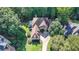 Stunning aerial view of the beautiful home showcasing its grand architecture and lush surroundings at 515 Butler National Dr, Johns Creek, GA 30097