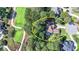 Beautiful home in a tranquil, wooded setting, as seen from above, circled in yellow for emphasis at 515 Butler National Dr, Johns Creek, GA 30097