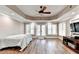 Basement area with hardwood floors, natural light, ceiling fan, and double doors at 515 Butler National Dr, Johns Creek, GA 30097