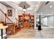 Spacious basement area with wood flooring, shelving, and large mirror at 515 Butler National Dr, Johns Creek, GA 30097
