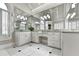 Bright bathroom features double sinks with granite countertops, vanity area, and large mirrors at 515 Butler National Dr, Johns Creek, GA 30097
