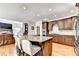 Spacious kitchen featuring island with seating, granite counters, and stainless appliances at 515 Butler National Dr, Johns Creek, GA 30097