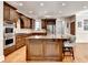 Well-appointed kitchen with granite countertops, stainless appliances, and hardwood floors at 515 Butler National Dr, Johns Creek, GA 30097