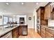 Gourmet kitchen featuring stainless steel appliances and beautiful wood cabinetry at 515 Butler National Dr, Johns Creek, GA 30097