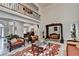 A grand living room showcases unique furniture, high ceilings, and an airy, open design at 515 Butler National Dr, Johns Creek, GA 30097