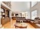 Spacious living room boasts built-in cabinets and an open design connecting to the kitchen at 515 Butler National Dr, Johns Creek, GA 30097