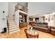 Open floor plan showing the staircase, kitchen and the living room with beautiful finishes at 515 Butler National Dr, Johns Creek, GA 30097