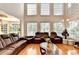 Bright living room showcasing high ceilings and large windows with an open layout at 515 Butler National Dr, Johns Creek, GA 30097