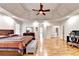 Large main bedroom features a tray ceiling, hardwood floors, and ample space at 515 Butler National Dr, Johns Creek, GA 30097