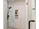 Beautiful walk-in shower featuring a mosaic tile accent wall and a modern shower head at 515 Butler National Dr, Johns Creek, GA 30097