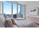 This bedroom features floor to ceiling windows with incredible views, and modern décor at 1080 Peachtree Ne St # 3507, Atlanta, GA 30309