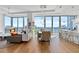 Open concept living and dining area boasting wood floors and floor-to-ceiling windows at 1080 Peachtree Ne St # 3507, Atlanta, GA 30309