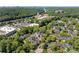 An aerial view of a neighborhood nestled among mature trees, with easy access to local amenities and highways at 15 Paces West Nw Dr, Atlanta, GA 30327