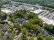 An aerial view of a residential neighborhood with mature trees, close to shopping centers and highway access at 15 Paces West Nw Dr, Atlanta, GA 30327