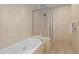Bathroom features a soaking tub and glass enclosed shower at 15 Paces West Nw Dr, Atlanta, GA 30327