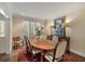 Formal dining room featuring plantation shutters, a wooden table, and a patterned rug at 15 Paces West Nw Dr, Atlanta, GA 30327
