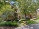 Beautiful home exterior with lush greenery and mature trees surrounding the property at 15 Paces West Nw Dr, Atlanta, GA 30327