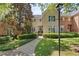 Charming home featuring manicured landscaping and a walkway leading to the front door at 15 Paces West Nw Dr, Atlanta, GA 30327