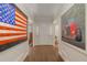 Elegant foyer with hardwood floors and art, creating a welcoming entrance at 15 Paces West Nw Dr, Atlanta, GA 30327