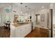 Open concept kitchen and dining area with granite countertops and stainless steel appliances in a bright, modern space at 15 Paces West Nw Dr, Atlanta, GA 30327
