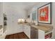 Bright kitchen features granite countertops, custom white cabinets, stainless steel appliances and hardwood flooring at 15 Paces West Nw Dr, Atlanta, GA 30327