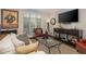 Relaxing living room with a large window, a comfortable couch, and a TV at 15 Paces West Nw Dr, Atlanta, GA 30327