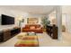 Finished basement with a leather sofa, TV, and colorful decor at 15 Paces West Nw Dr, Atlanta, GA 30327