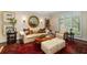 Cozy living room with a red patterned rug, neutral furniture, and bright window light at 15 Paces West Nw Dr, Atlanta, GA 30327