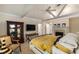 Bright main bedroom with a fireplace, ceiling fan and decorative display cabinet at 15 Paces West Nw Dr, Atlanta, GA 30327