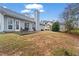 Large backyard with a patio and plenty of space for outdoor activities at 3130 Goldmist Dr, Buford, GA 30519
