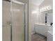 Bright bathroom features a glass shower and vanity with ample storage space at 3130 Goldmist Dr, Buford, GA 30519