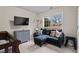 Bedroom with a window providing natural light, featuring a comfortable couch and grey dresser at 3130 Goldmist Dr, Buford, GA 30519