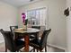 Dining area with round table next to a window, promoting lots of natural light at 3130 Goldmist Dr, Buford, GA 30519